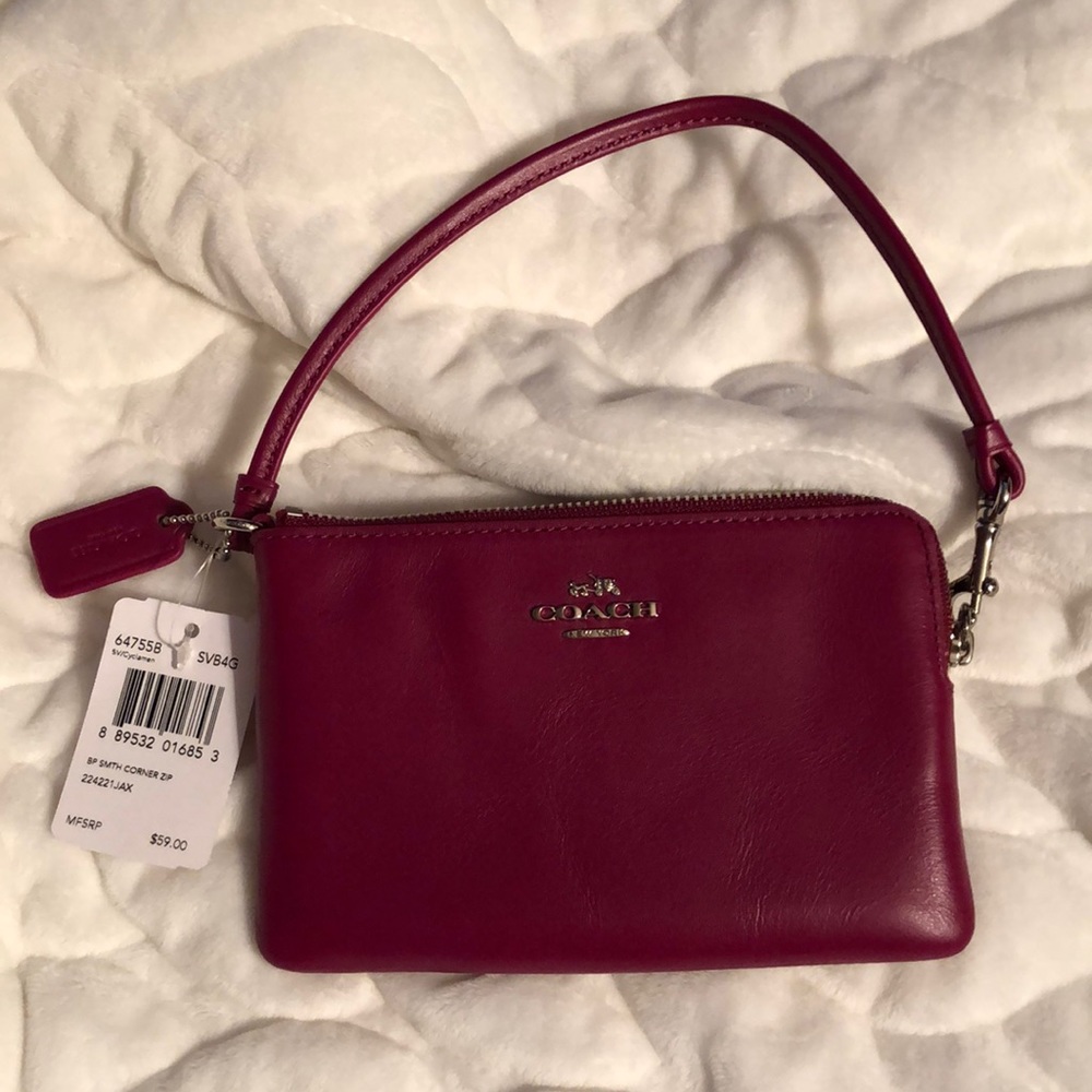NWT leather Coach wristlet, burgundy color